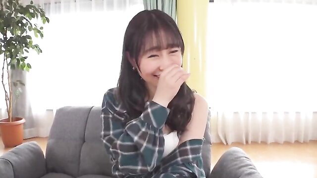 Cute Asian JAV girl with bangs laughing in plaid shirt, smiling cutely