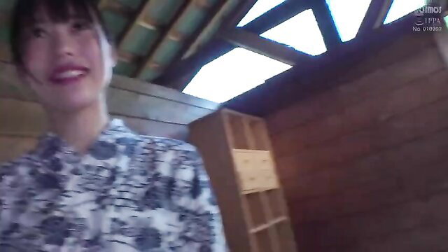 Asian beauty in patterned blouse smiling in rustic JAV scene