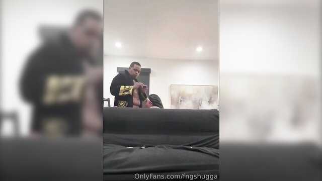 Blurry amateur couple on new sofa, man behind woman in black hoodie