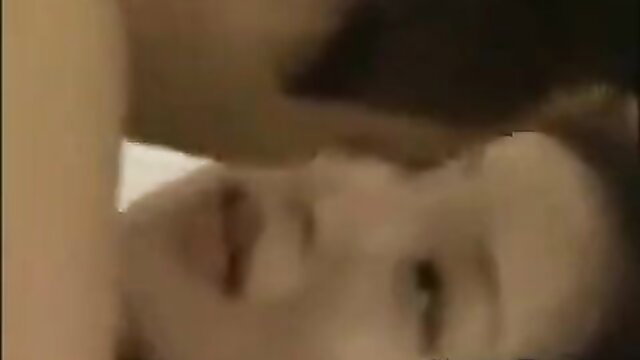 Japanese stepdaughter passionately kissing man in bed closeup