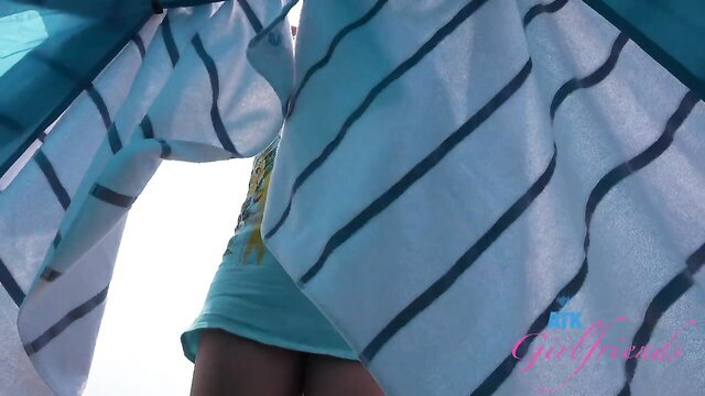Lily Adams in teal dress and striped sarong at beach, ATKGirlfriends