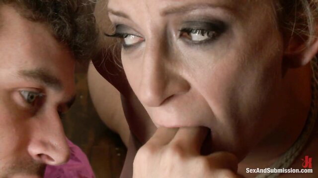 Sara Jay gagging fingers in intense BDSM submission scene