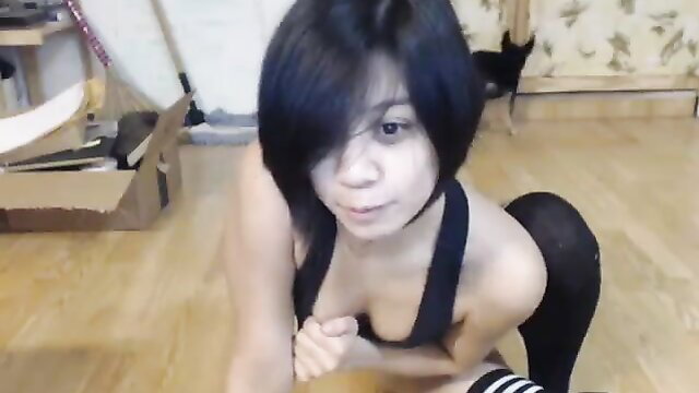 Nekolukka Asian babe in tank top stockings squats floor masturbation