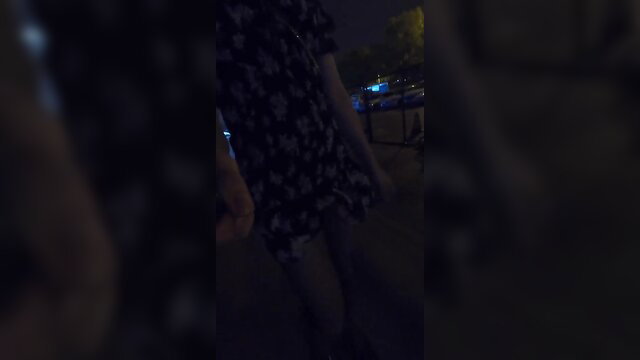 Elia Blaine trans in floral dress walks street at night, Suki Trans
