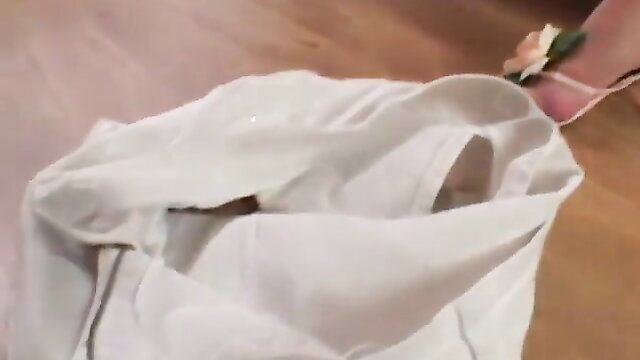 Brunette smiling happily dildoing her holes in white dress