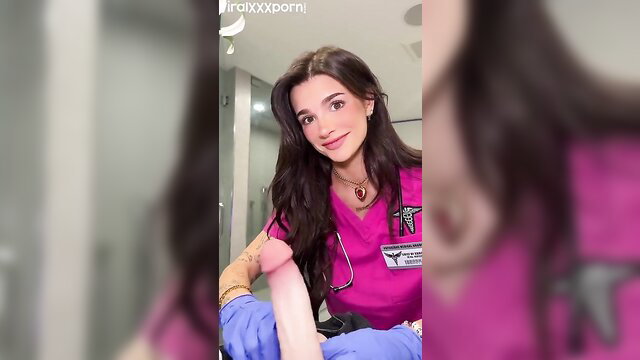 Arikytsya as sexy nurse in pink scrubs holding huge pink dildo POV