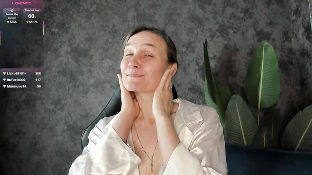 Lillian White milf in silk robe touching face on cam