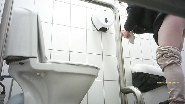 Amateur Asian teen pulling down panties in public toilet spy cam