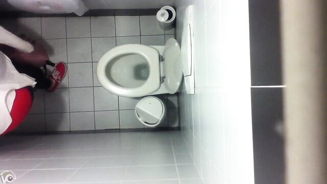 Ceiling cam captures black girl pissing in public toilet