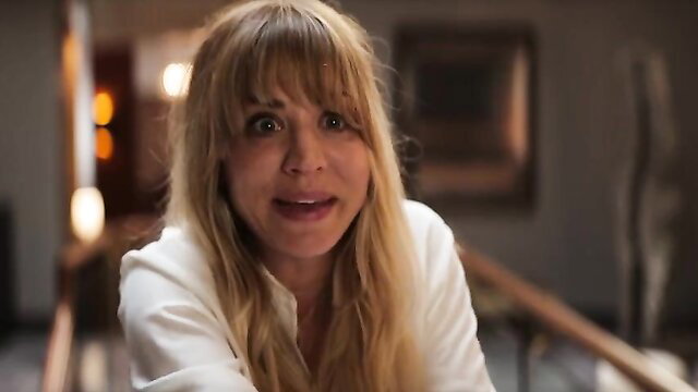 Kaley Cuoco wide-eyed shocked face in tight white blouse, hot celeb scene