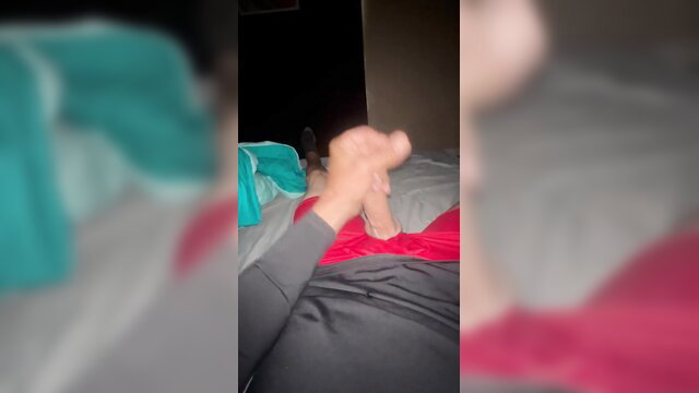 Amateur solo male handjob on bed, grey sweats pulled down