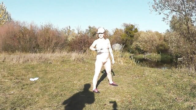 Nude MILF Frina plays badminton outdoors in autumn, big tits ass exposed
