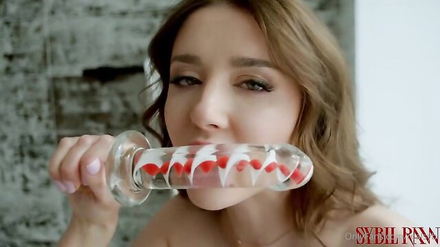 Sybil sucks huge glass double dildo in hot solo scene