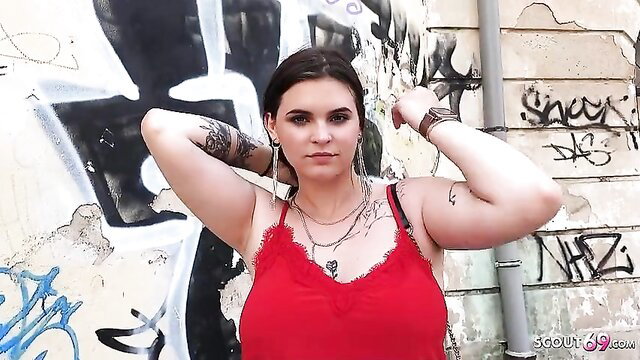 Curvy teen Taylee Wood in red lingerie posing with tattoos by graffiti wall