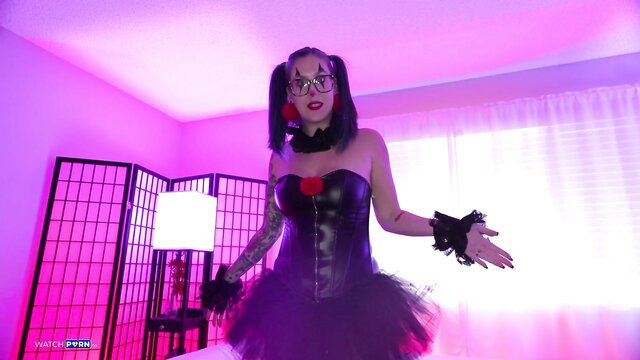 Nikki Zee in sexy black latex corset and tutu, goth cosplay pose