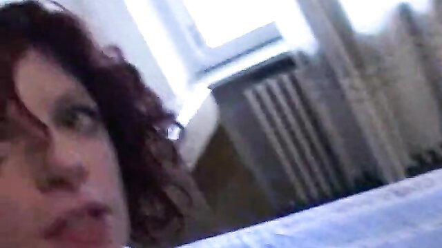 Closeup of sexy Italian amateur MILF with red curly hair and full lips