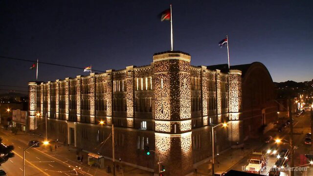 Lit prison building at night with flags, savage sensual black chicks fight thumbnail