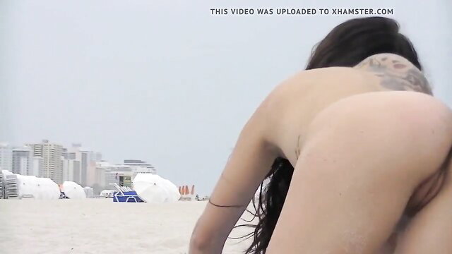 Exhibitionist Wifey Alison taunts on beach, topless tattooed ass view voyeur cam