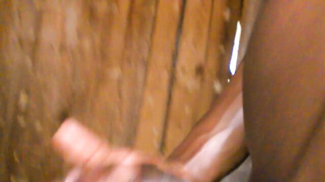 Closeup of veiny black BBC monster cock gripped by dark hand