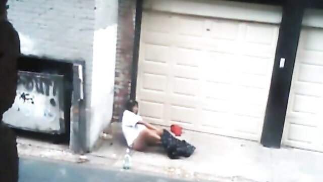 Nasty hooker in white tank top and shorts pleasures client in gritty alley