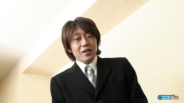 Handsome Japanese man in suit smiling at JAV office lesbian tease