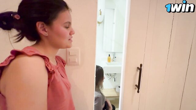 Amateur Asian teen in pink dress peeking at girl in bathroom