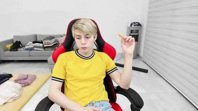 Blond twink in yellow shirt holds object, gay bwc tease thumbnail