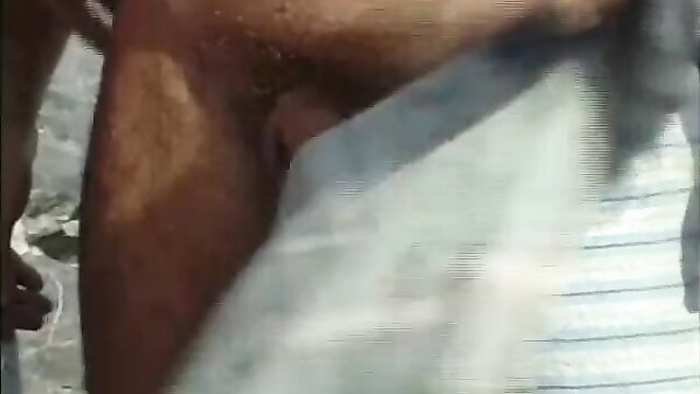 Hairy man stroking thick erect cock in explicit closeup