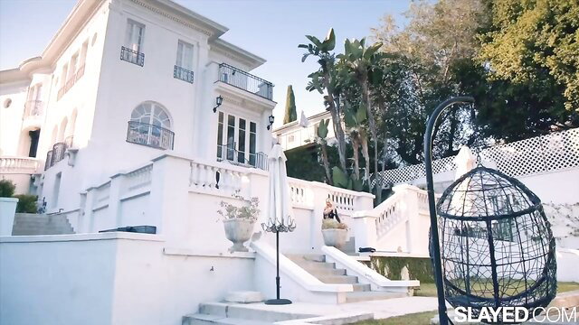 Hot blondes in bikinis tease by white mansion pool