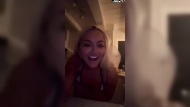 Lindsey Pelas smiling in bikini top, nude Halloween livestream tease