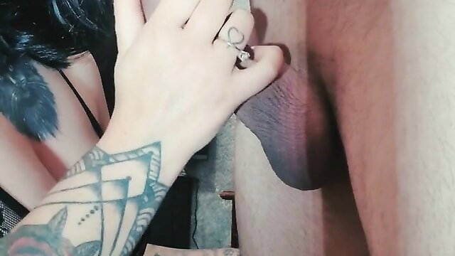Tattooed goth girl handjob on big cock closeup