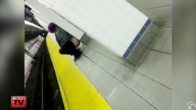 Purple-haired babe squats and pees on subway platform edge
