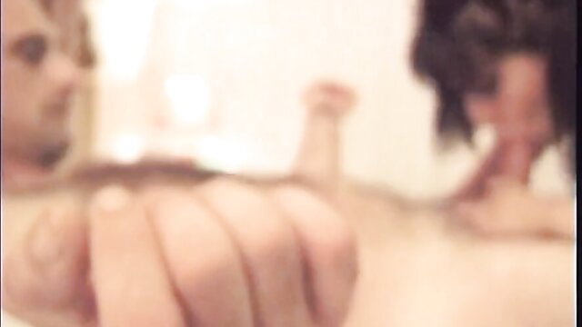 Blonde and brunette women in steamy lesbian bathroom sex scene