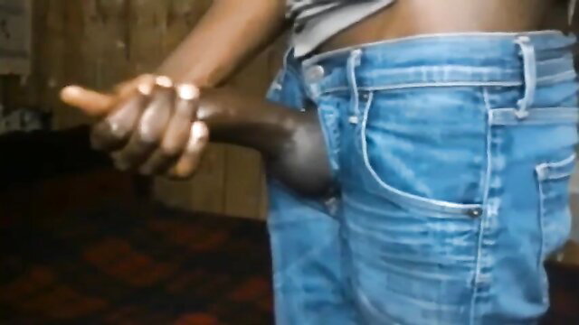 Black hunk pulling out huge dark cock from jeans in solo tease