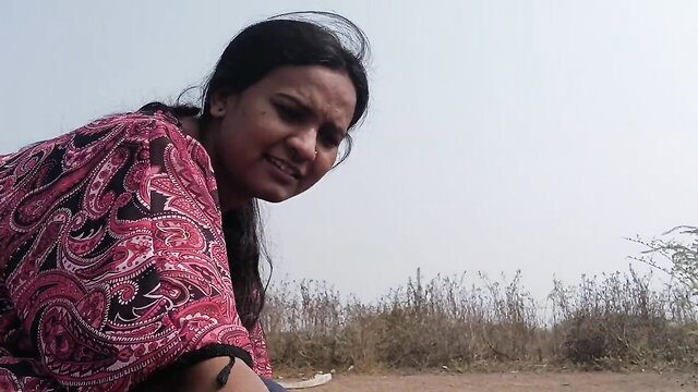 Indian village woman in pink saree blouse, smiling outdoor closeup