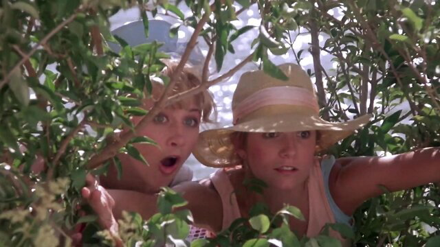 Lea Thompson and friend spying from bushes at nudist beach in Casual Sex? 1988