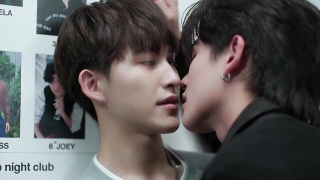Two handsome Asian men passionately kissing close-up in Boys Love cut