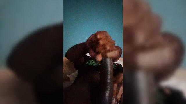 Black man handjobbing huge thick black cock closeup amateur