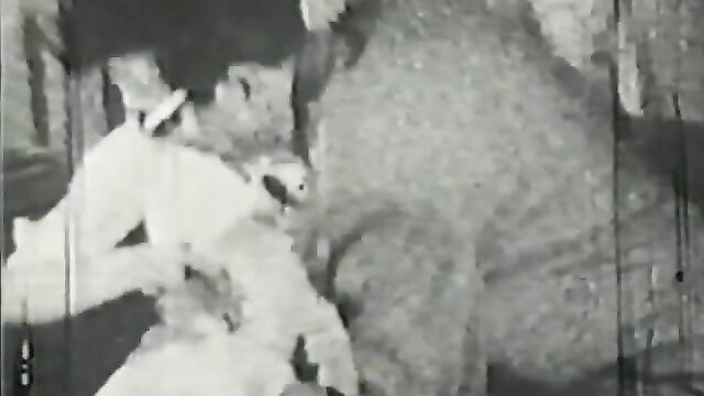 Vintage stag film thumbnail: woman sucks man's cock closeup, retro porn