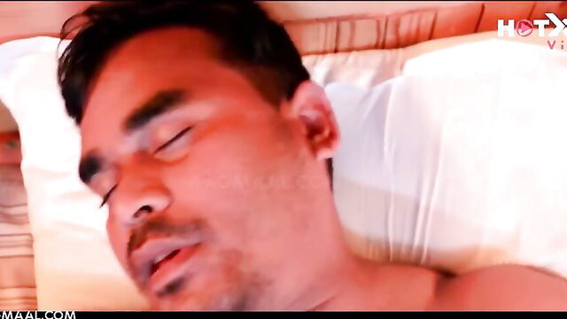 Indian horny MILF sleeping topless on bed in hot sex video