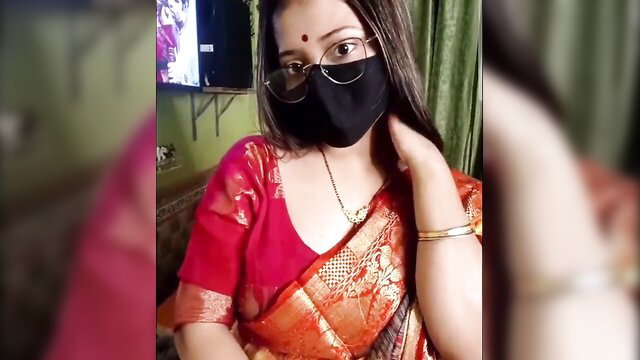 Desi Indian girl in red saree and mask, sexy cleavage tease