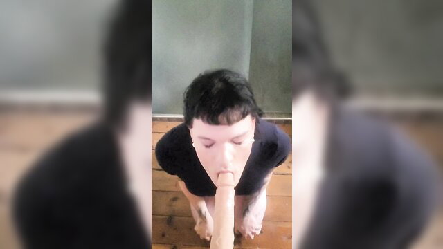Tattooed trans employee kneels sucking cock to keep job
