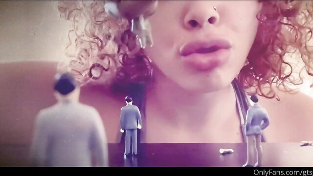 Ebony giantess with giant lips over tiny suited men vore fetish