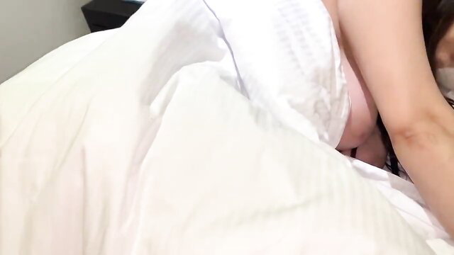 Asian stepmom sleeping nude in hotel bed, exposed breast peek