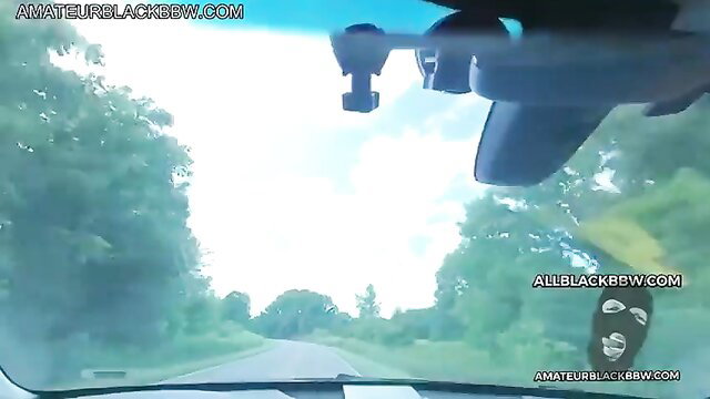 POV dashcam drive on rural road with masked man watermark