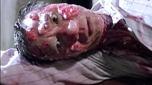 Mutilated face with blood and gore