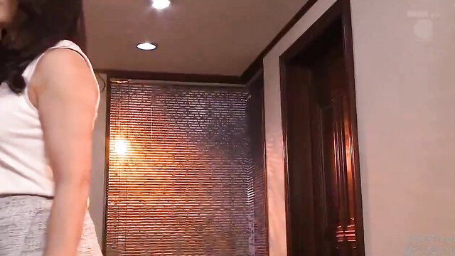 Momoko Isshiki in tight white tank top and shorts, sexy side pose