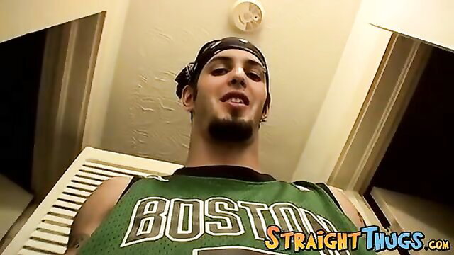 Goatee thug Axel in green Boston jersey, bandana, goatee, low angle view