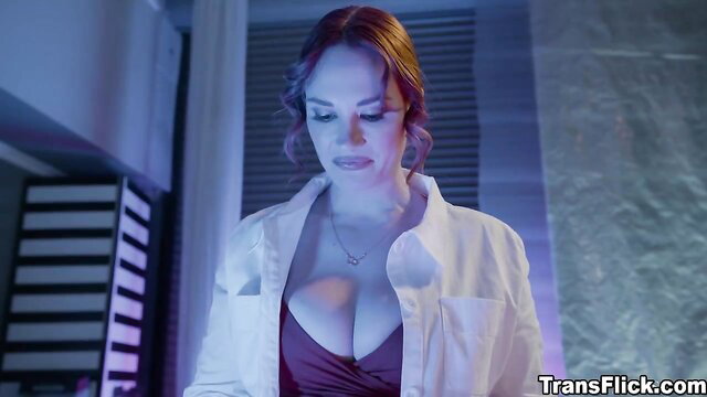 Redhead scientist in open lab coat revealing huge cleavage closeup