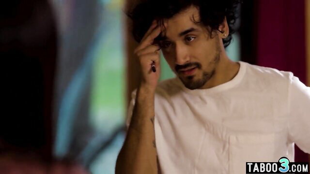 Shy Indian guy with hand on forehead in tense taboo stepmom scene